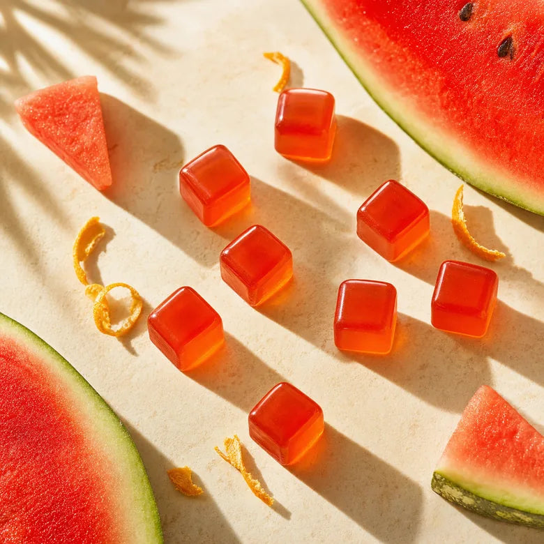 Watermelon tanning drops on cream surface